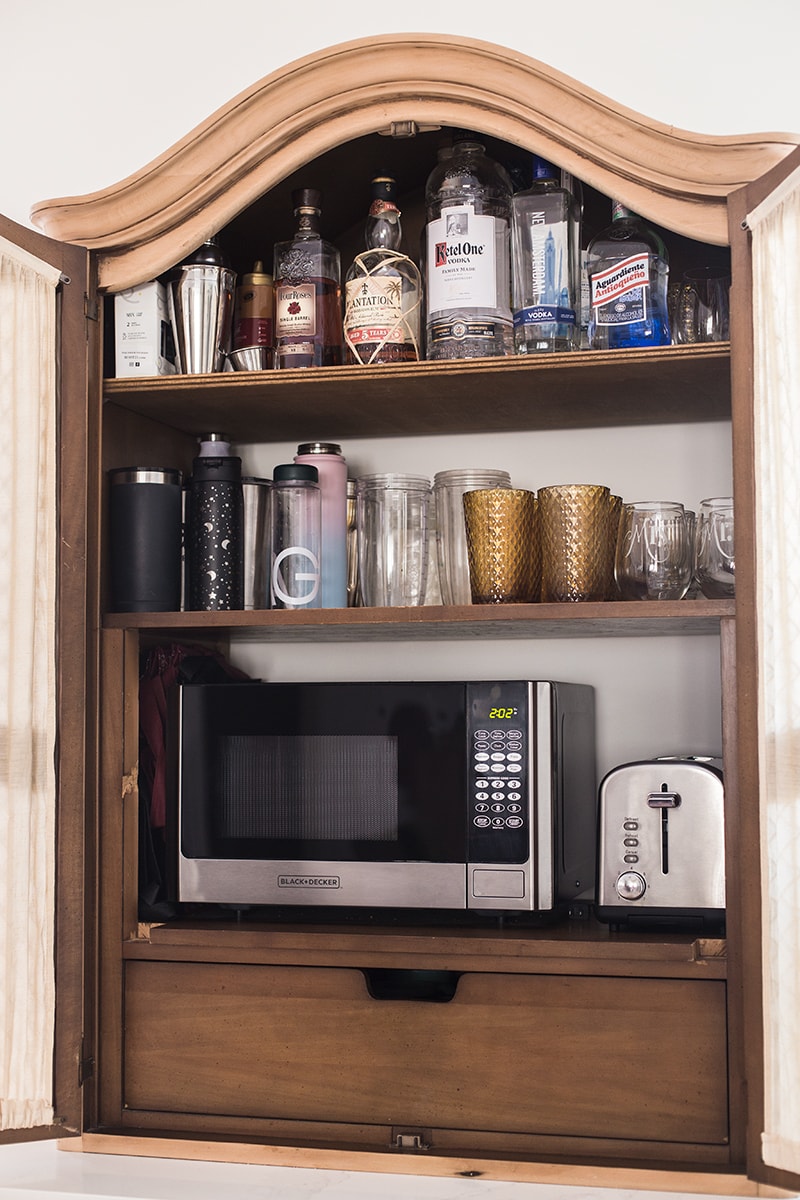 https://www.jennasuedesign.com/wp-content/uploads/2022/01/hidden-appliance-cabinet.jpg