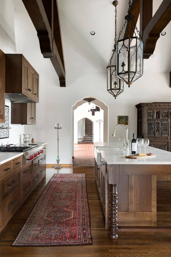 spanish style kitchen with dark wood accents