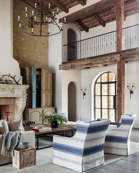 european style living room with wood beams