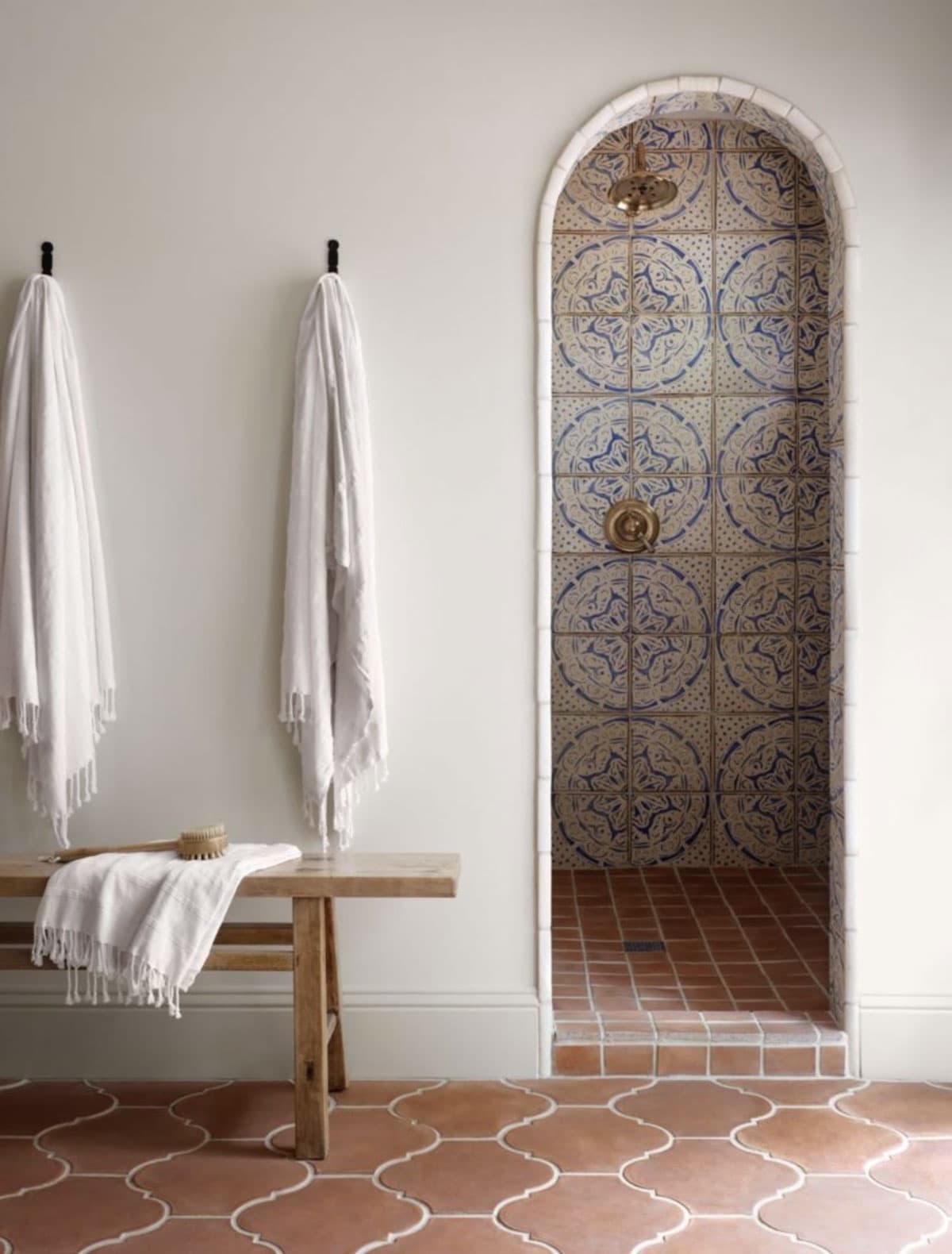 spanish style bathroom with patterned shower tile