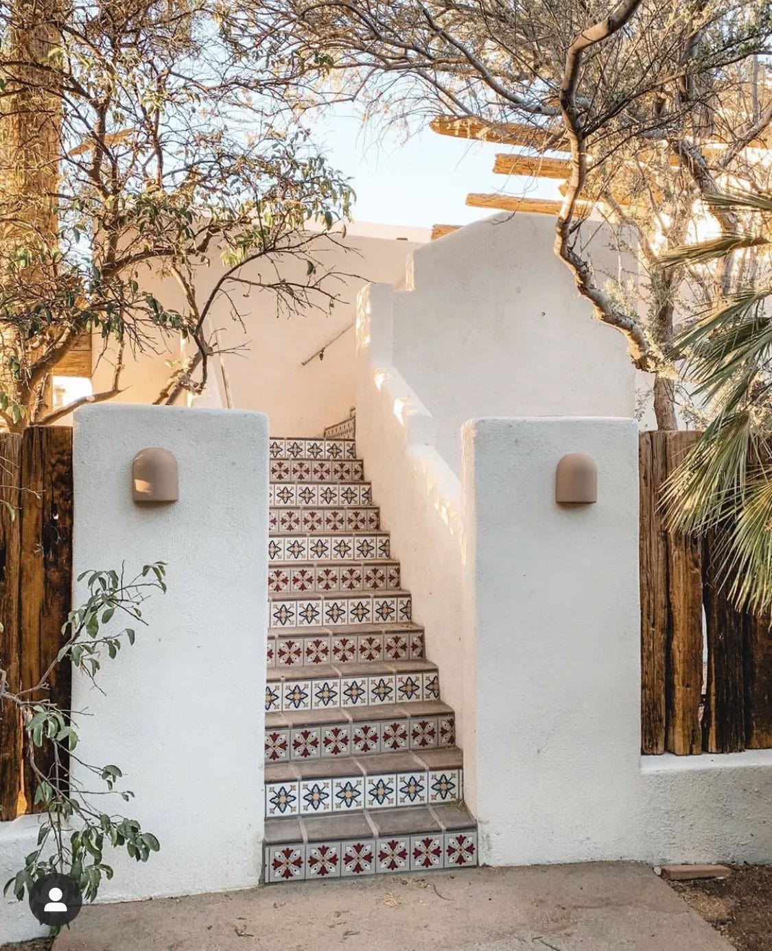 spanish style entry with patterned tile stair risers